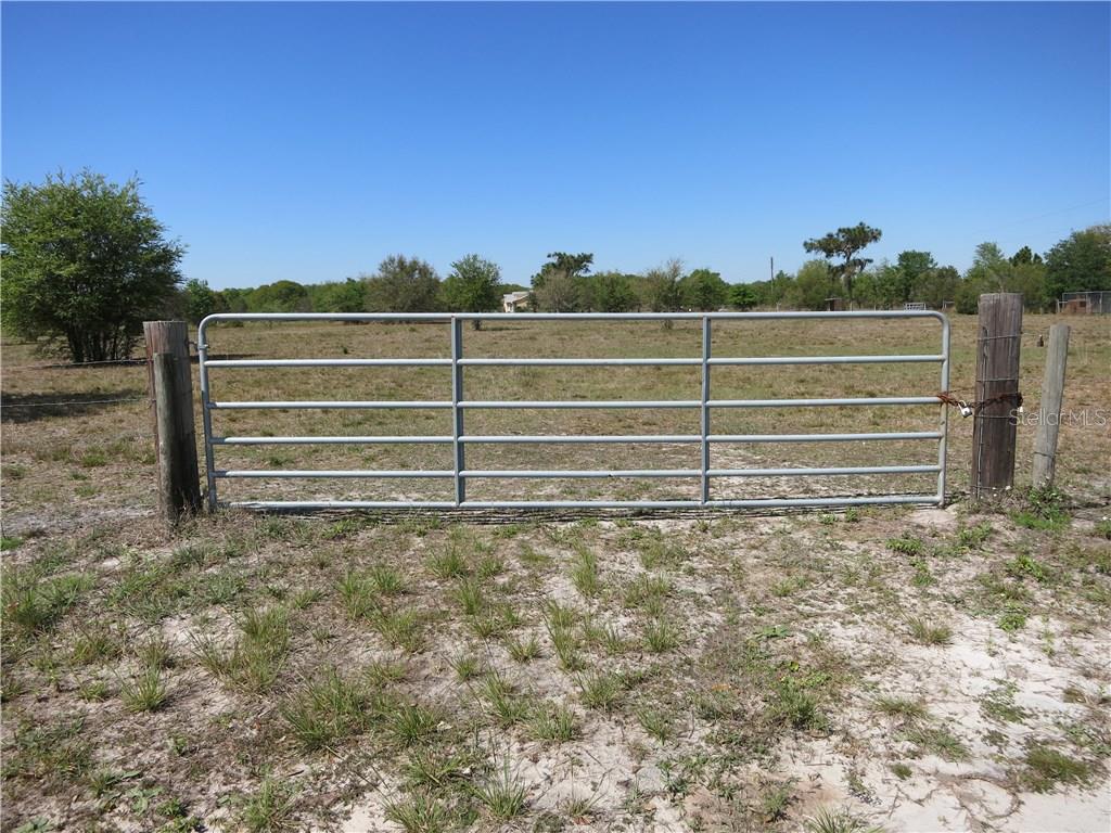 240 Long Road Ona, FL 33865 - Photo 1 of 1 Frontage with large drive through gate.