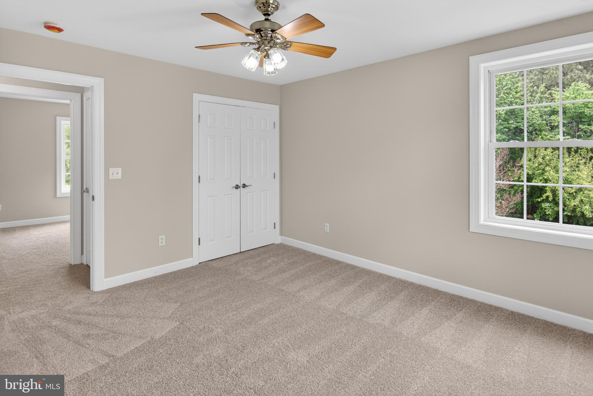 337 Roe Ingleside Road Centreville, MD 21617 - Photo 37 of 56 an empty room with a window and a fan