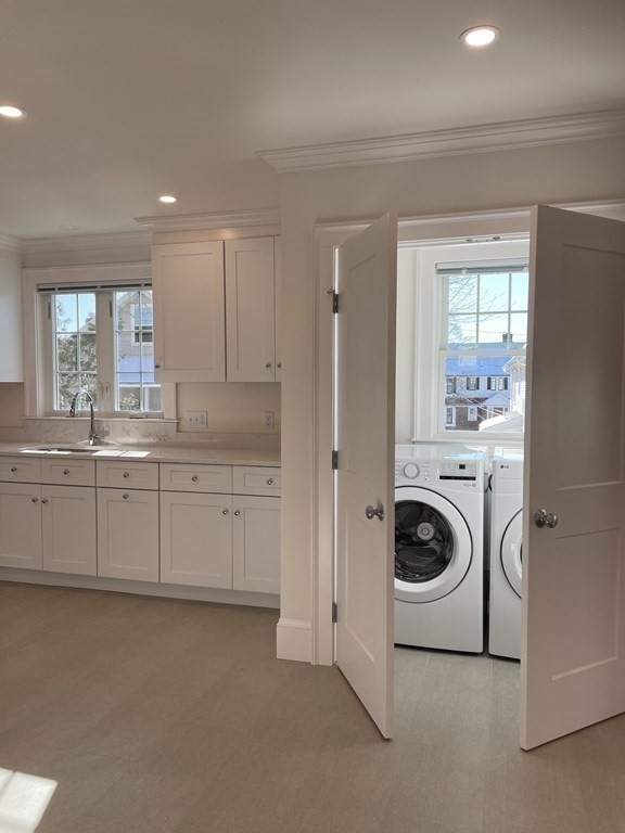 55 Dalton Road, Unit 1 Belmont, MA 02478 - Photo 12 of 16 a kitchen with a stove top oven sink and cabinets