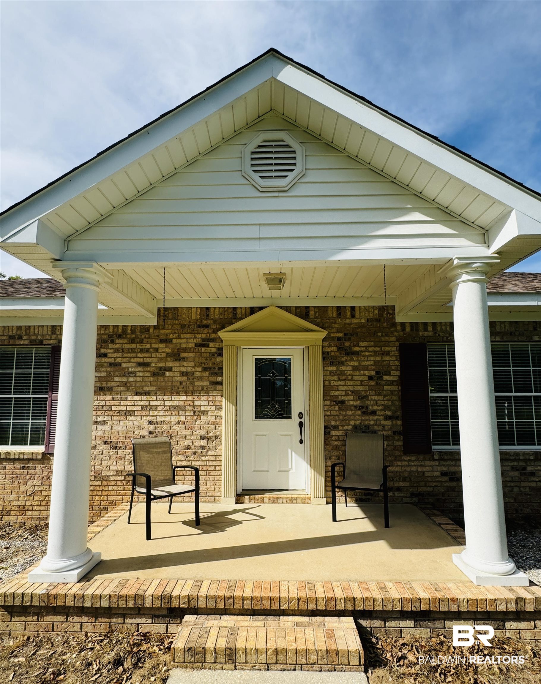 13795 White Road Silverhill, AL 36576 - Photo 86 of 99 View of exterior entry featuring brick siding and a porch