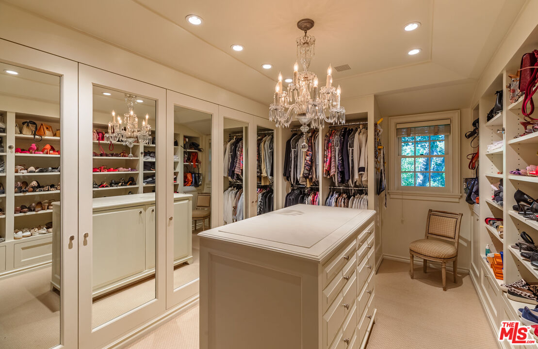 685 Elkins Road Los Angeles, CA 90049 - Photo 14 of 24 a room with a chandelier furniture and a chandelier