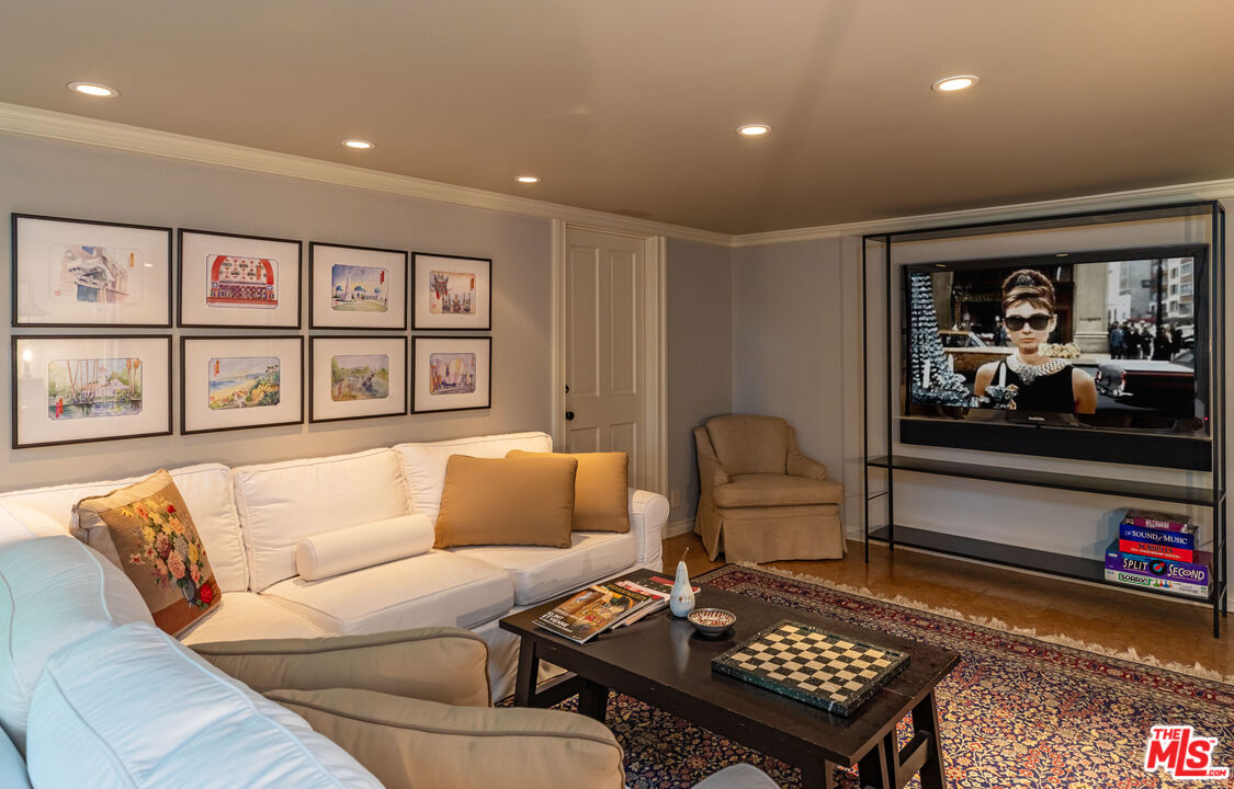 685 Elkins Road Los Angeles, CA 90049 - Photo 19 of 24 a living room with furniture and a rug