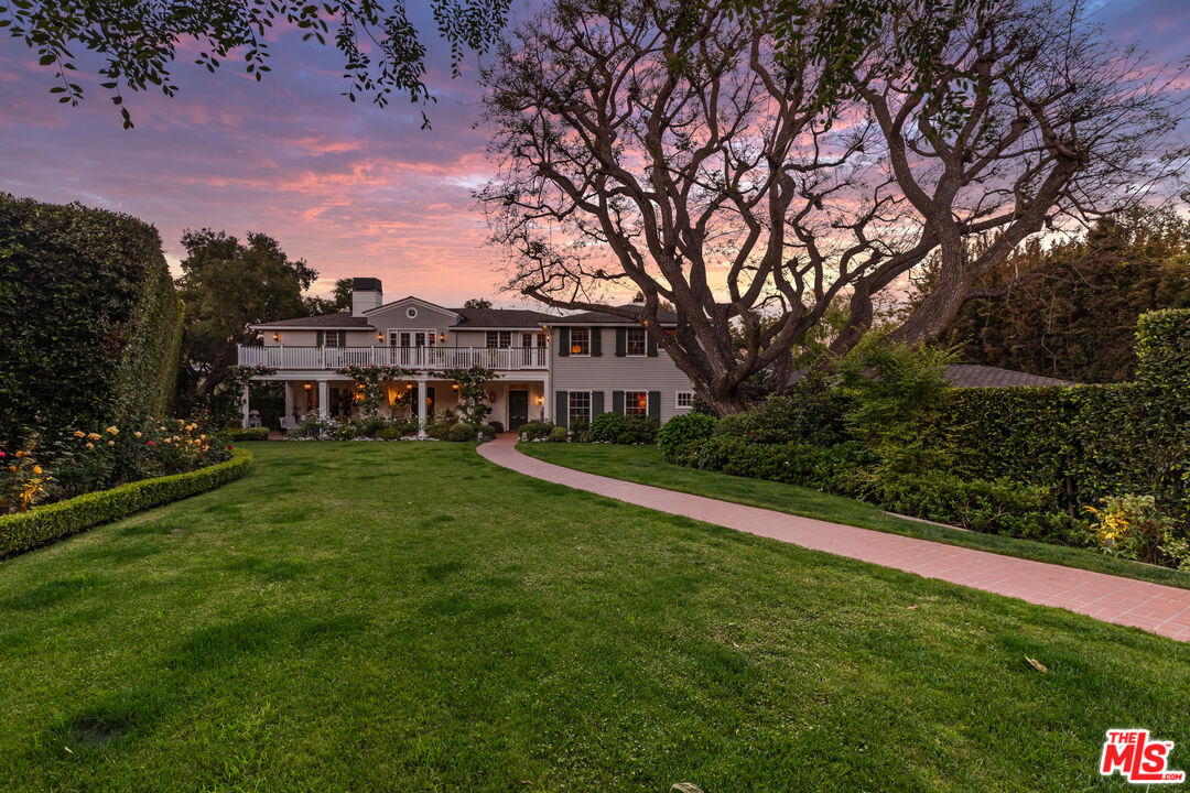 685 Elkins Road Los Angeles, CA 90049 - Photo 24 of 24 a view of a house with a big yard