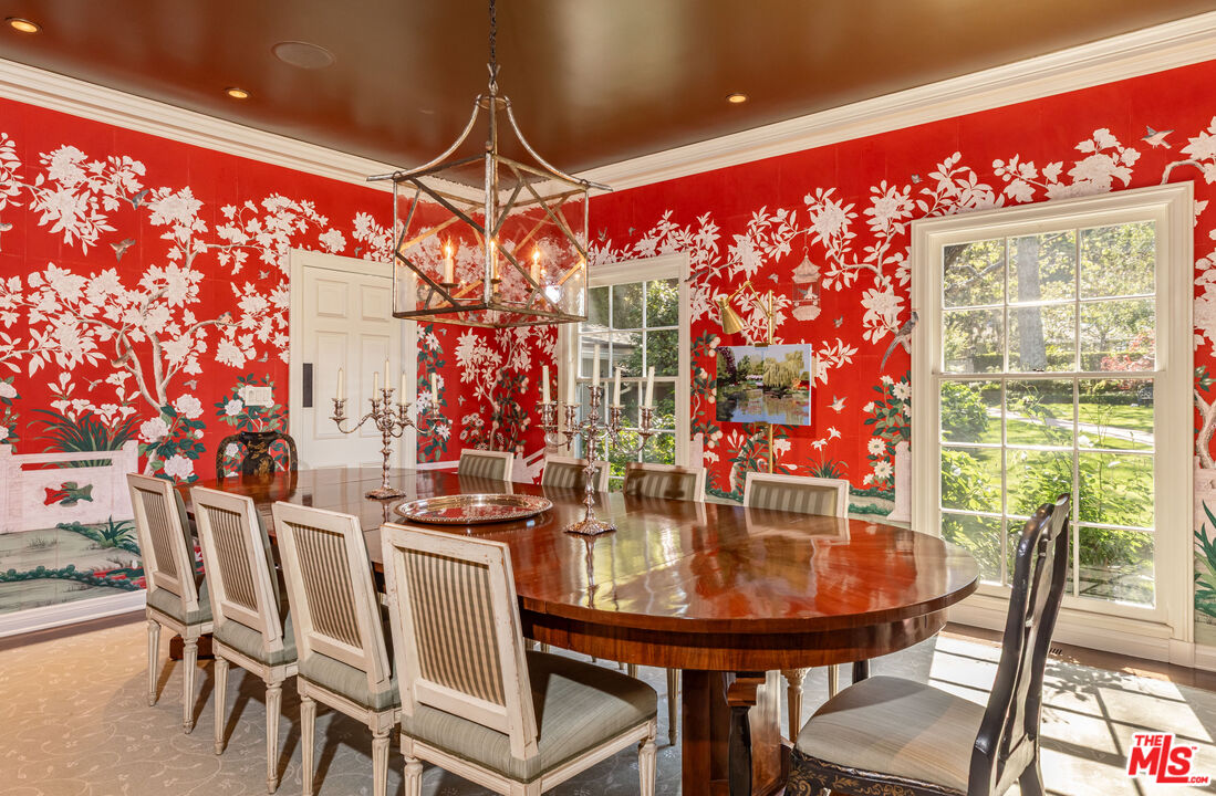 685 Elkins Road Los Angeles, CA 90049 - Photo 6 of 24 a view of a dining room with furniture and chandelier