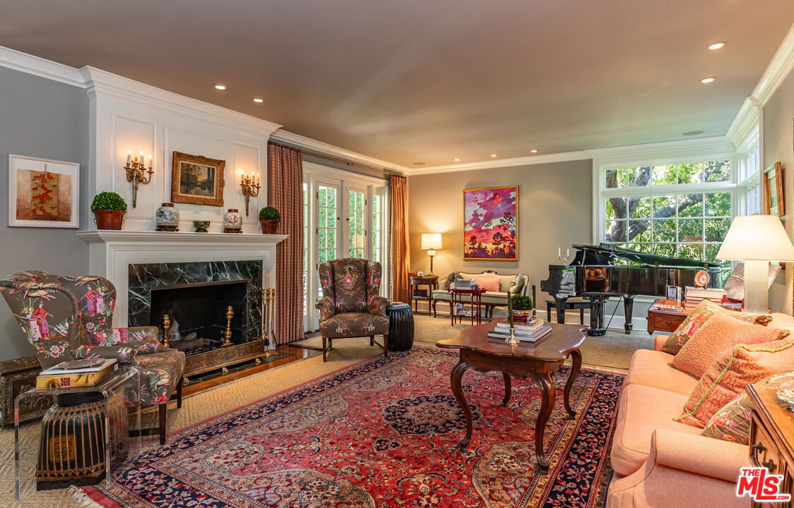 685 Elkins Road Los Angeles, CA 90049 - Photo 9 of 24 a living room with furniture fireplace and window