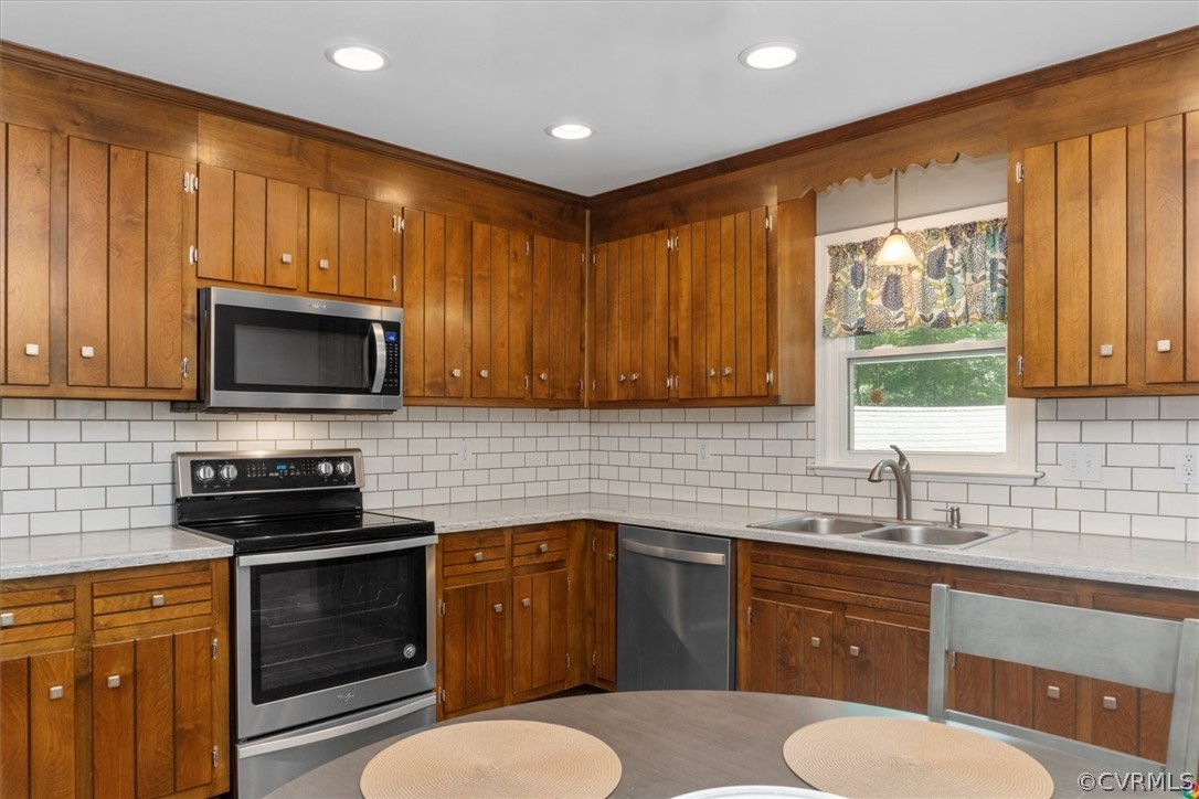 10211 Robbie Road Chesterfield, VA 23832 - Photo 14 of 50 a kitchen with a sink stove and microwave