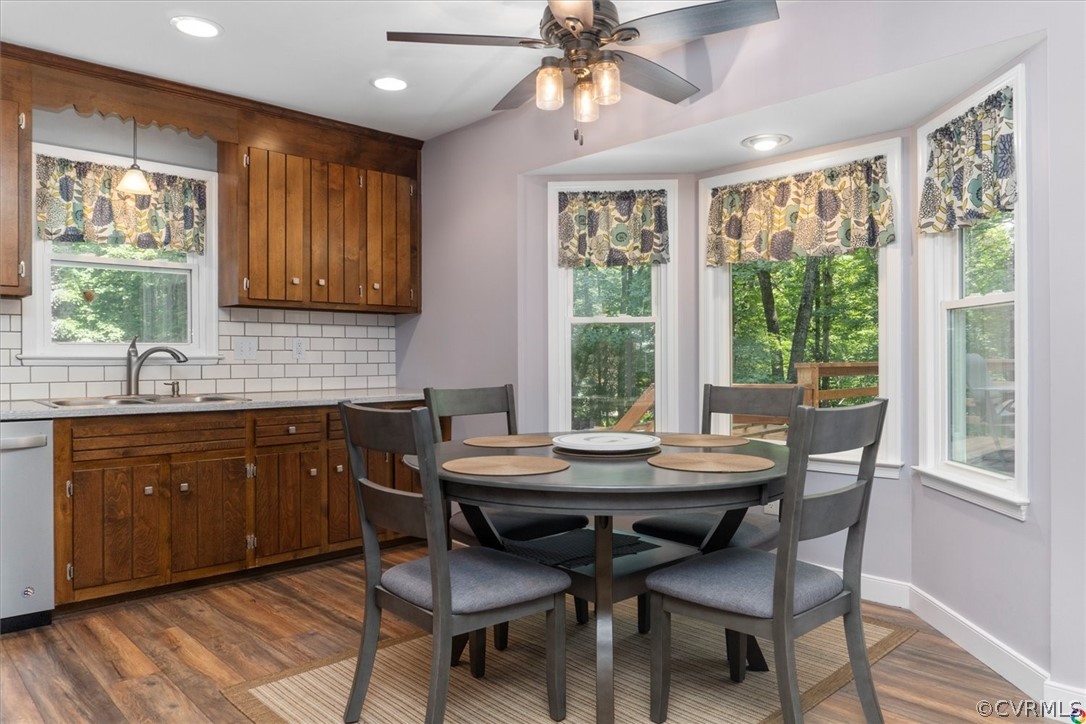 10211 Robbie Road Chesterfield, VA 23832 - Photo 18 of 50 a dining room with a wooden table and chairs