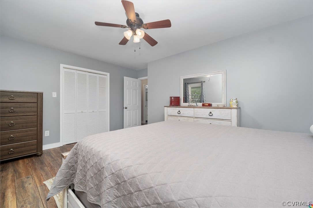 10211 Robbie Road Chesterfield, VA 23832 - Photo 26 of 50 a bedroom with a bed and a chandelier