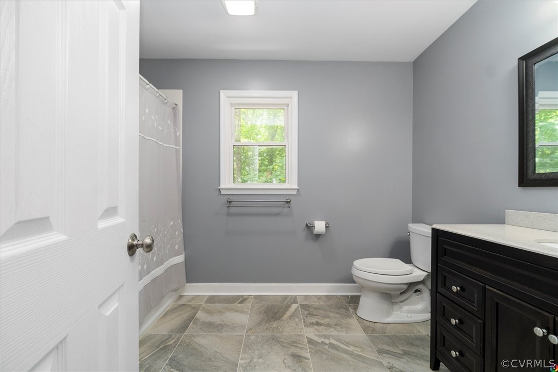 10211 Robbie Road Chesterfield, VA 23832 - Photo 33 of 50 a bathroom with a sink toilet and window