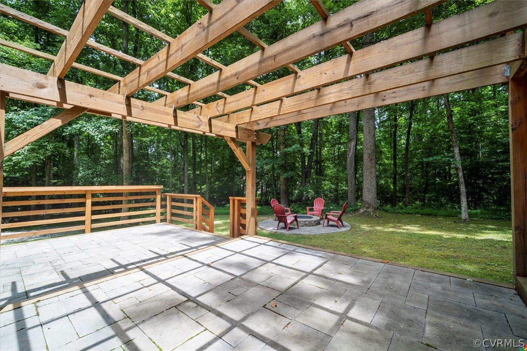 10211 Robbie Road Chesterfield, VA 23832 - Photo 40 of 50 a view of outdoor space with seating area and trees in the background