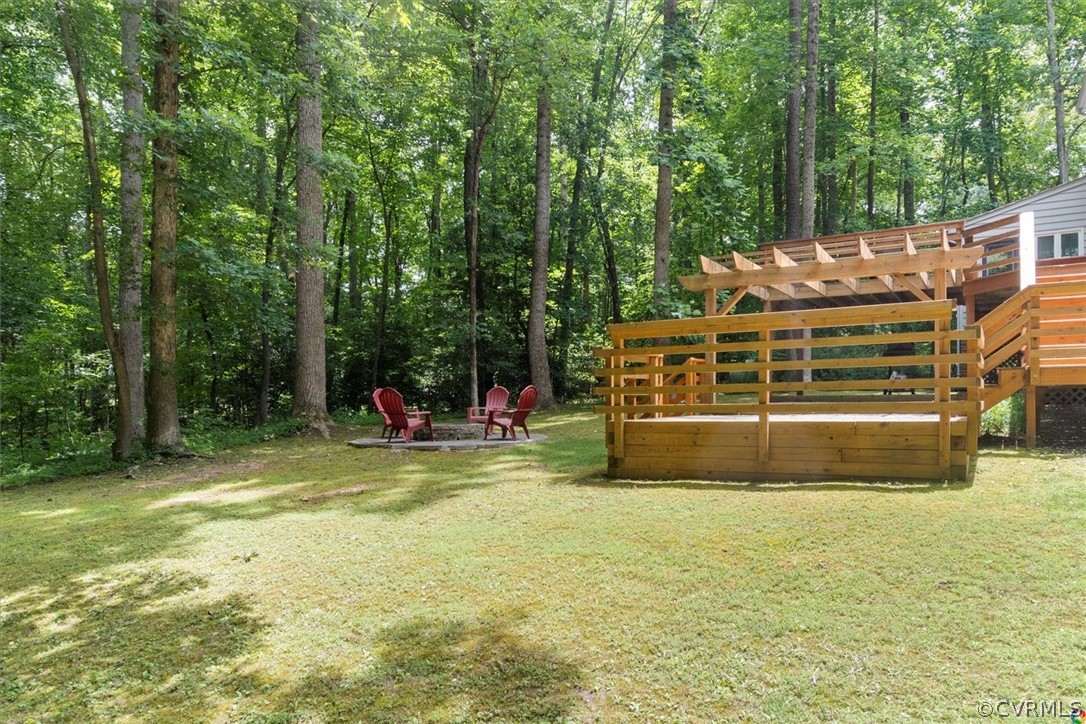 10211 Robbie Road Chesterfield, VA 23832 - Photo 45 of 50 a view of swimming pool with lawn chairs and large trees