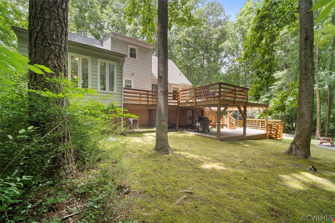 10211 Robbie Road Chesterfield, VA 23832 - Photo 48 of 50 a view of a house with backyard and a tree