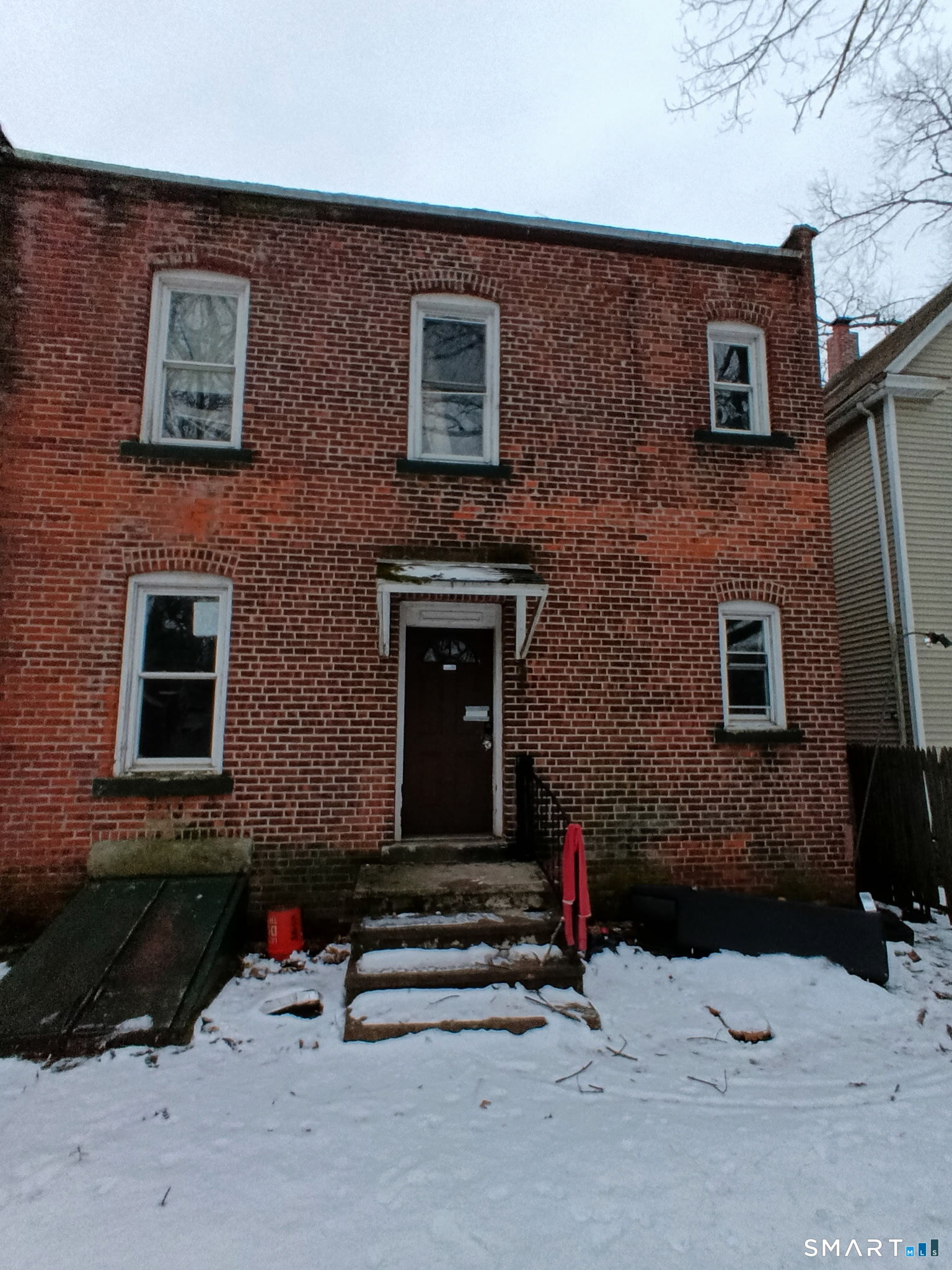 46 Shepard Street New Haven, CT 06511 - Photo 2 of 6 a front view of a house with a yard