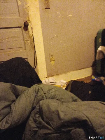 a bedroom with a bed and a walk in closet