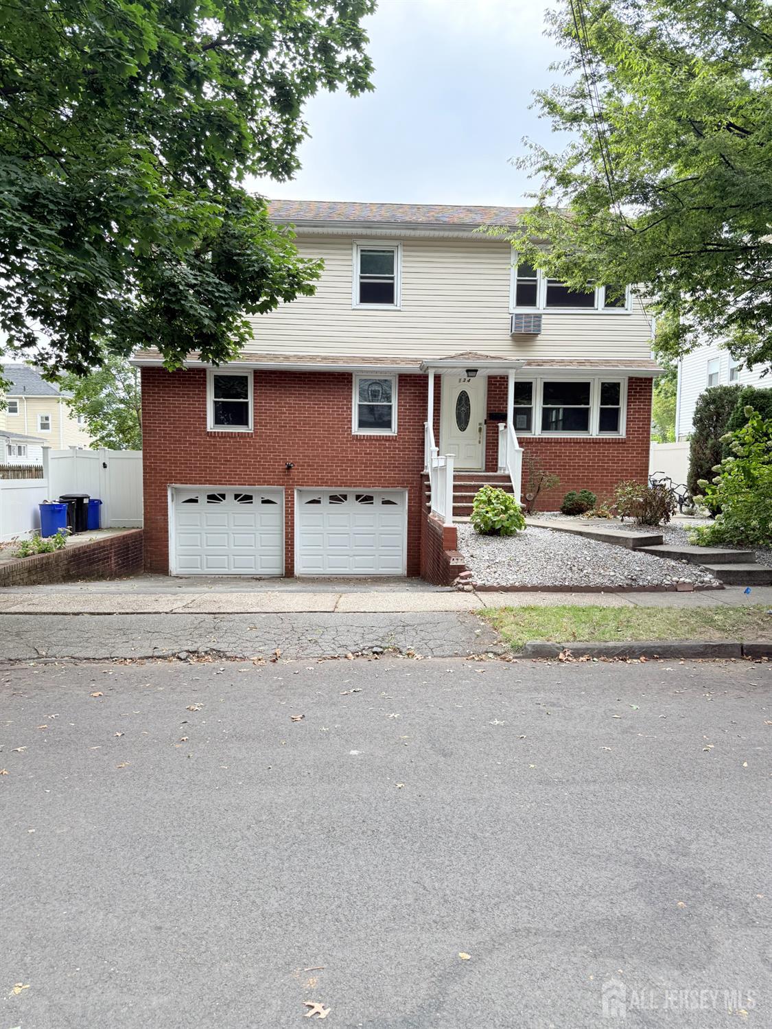 134 Oak Street, Unit 1 Rahway, NJ 07065 - Photo 1 of 16 front view of a house with a street
