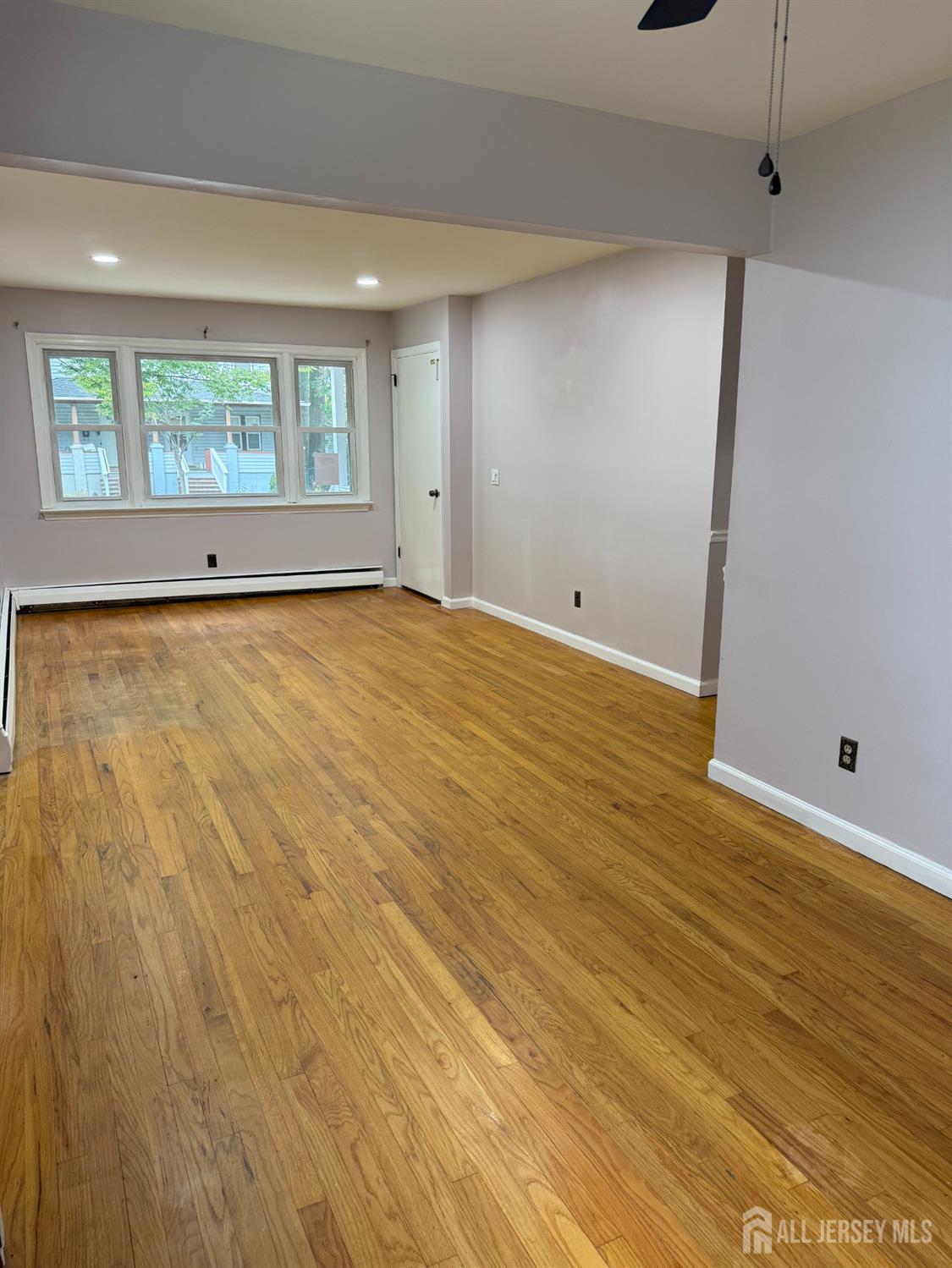 134 Oak Street, Unit 1 Rahway, NJ 07065 - Photo 2 of 16 a view of an empty room with a window