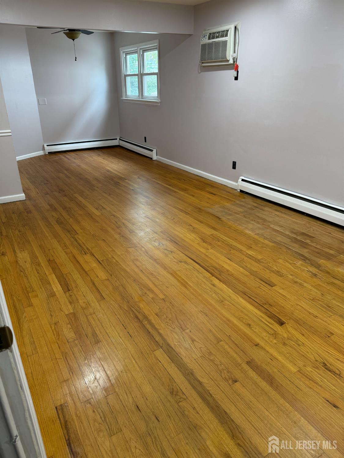 134 Oak Street, Unit 1 Rahway, NJ 07065 - Photo 3 of 16 wooden floor in an empty room