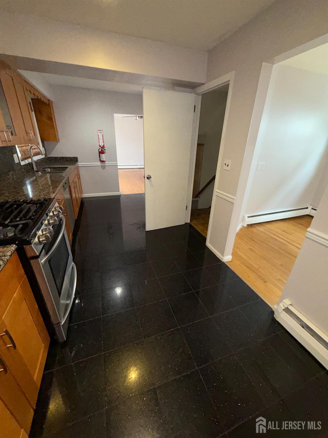 134 Oak Street, Unit 1 Rahway, NJ 07065 - Photo 6 of 16 a view of a livingroom with wooden floor
