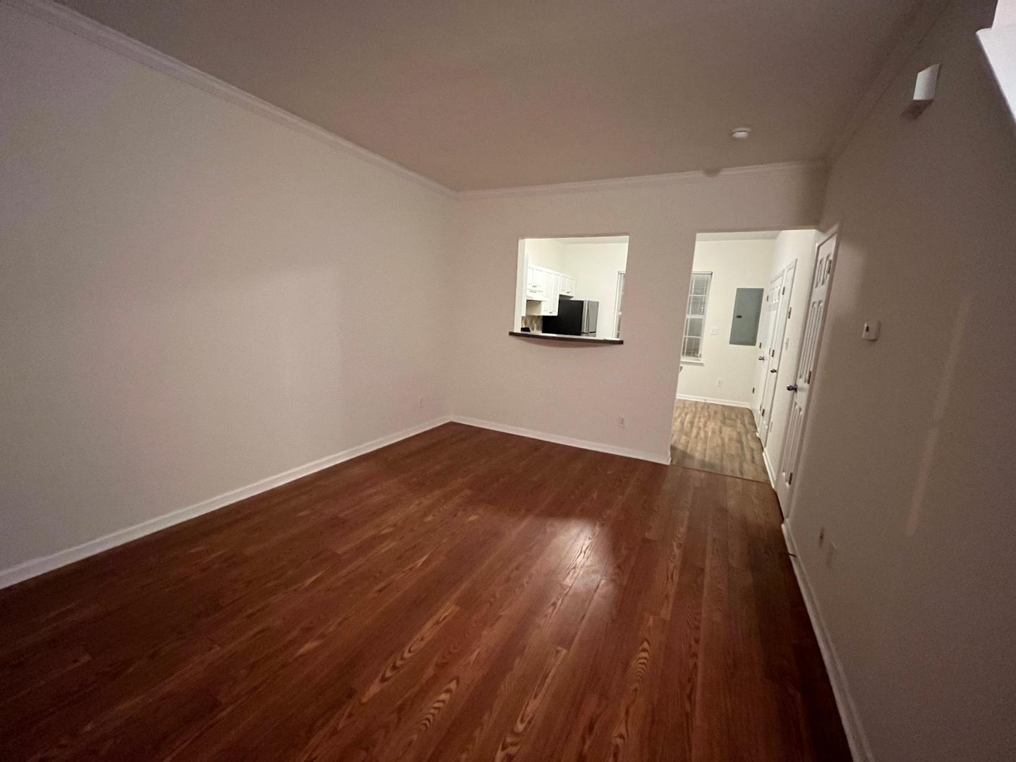 156 Blue Crest Lane Durham, NC 27705 - Photo 3 of 13 a view of a hallway with wooden floor and a bathroom