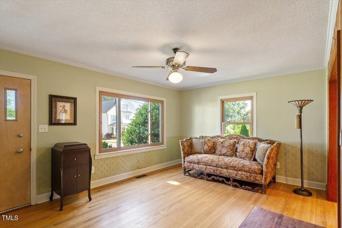 708 Mills Street Raleigh, NC 27608 - Photo 14 of 39 a living room with a couch and a window