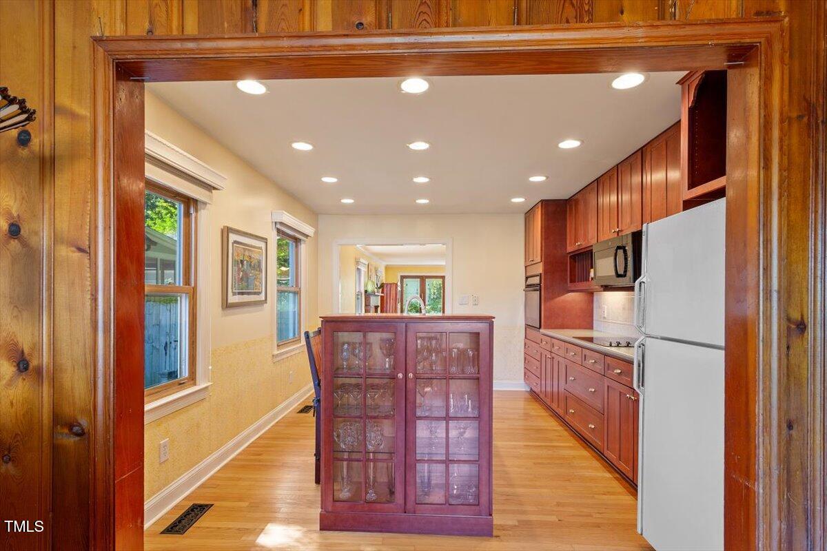 708 Mills Street Raleigh, NC 27608 - Photo 17 of 39 a view of kitchen with furniture and wooden floor
