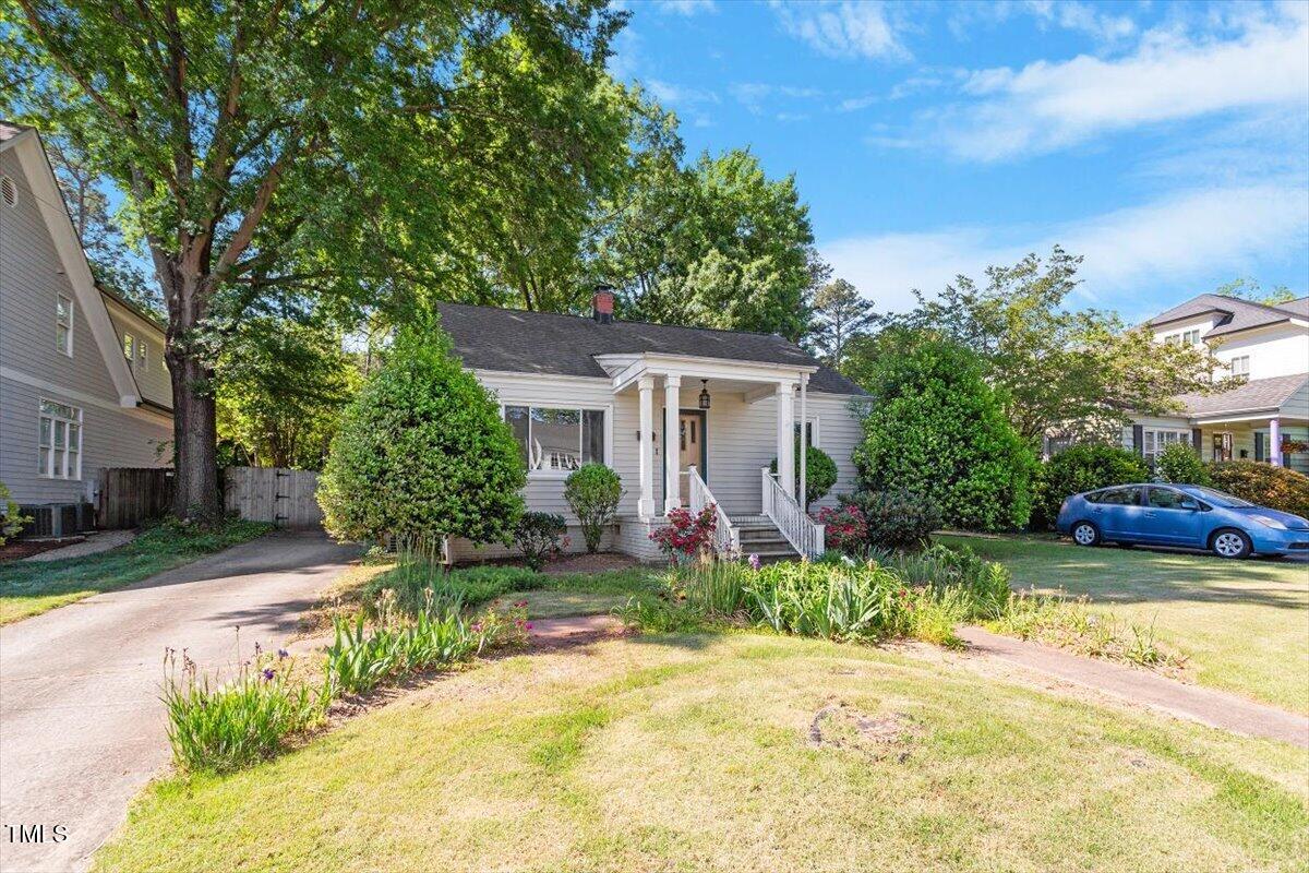 708 Mills Street Raleigh, NC 27608 - Photo 2 of 39 a view of a house with backyard and sitting area