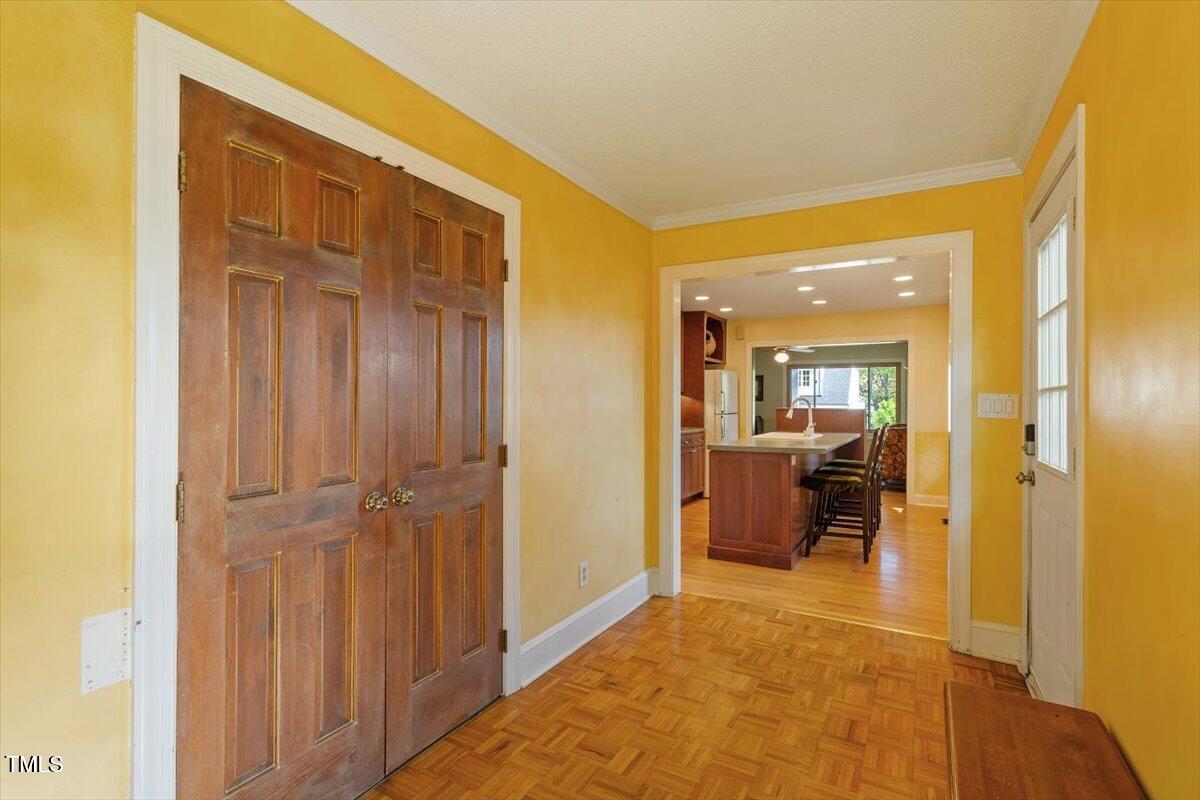 708 Mills Street Raleigh, NC 27608 - Photo 29 of 39 a view of a hallway with living room and bathroom view