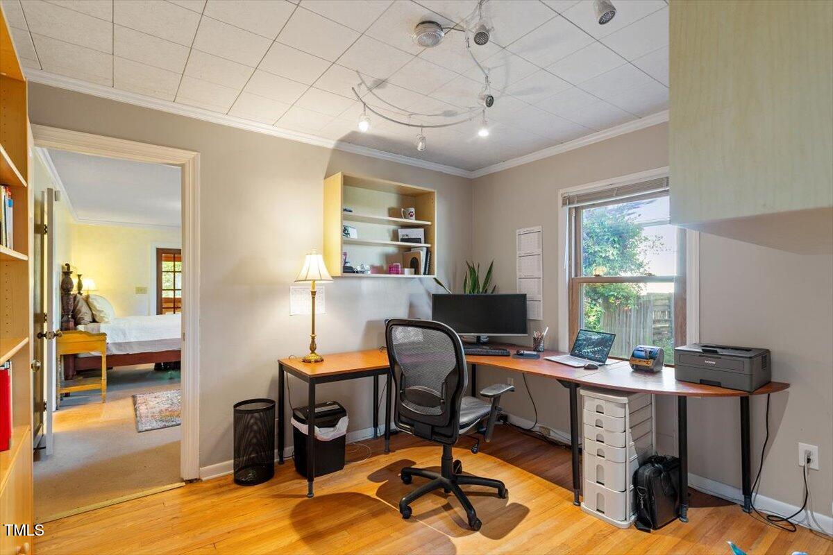 708 Mills Street Raleigh, NC 27608 - Photo 32 of 39 a view of a workspace with furniture and a window