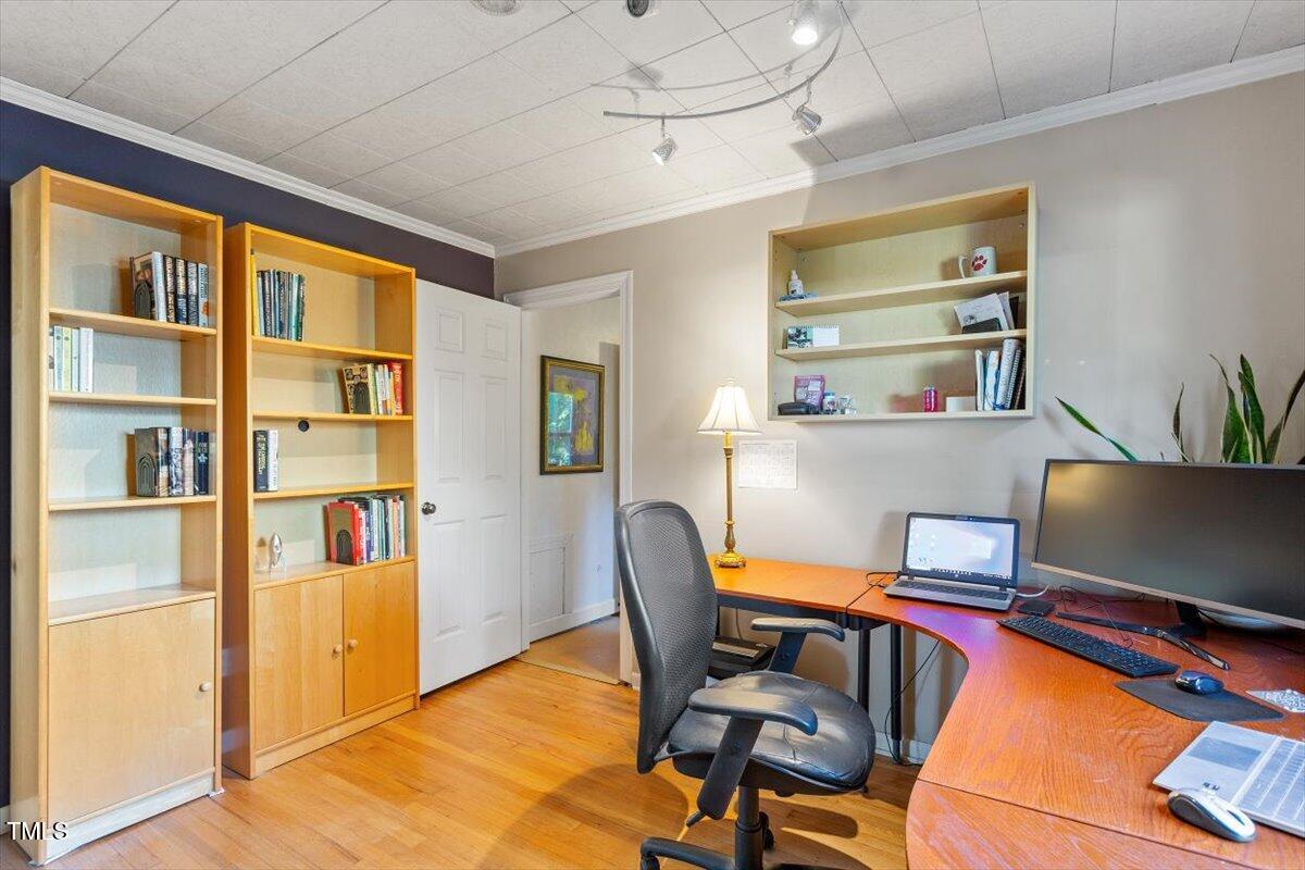 708 Mills Street Raleigh, NC 27608 - Photo 33 of 39 a workspace with furniture and window