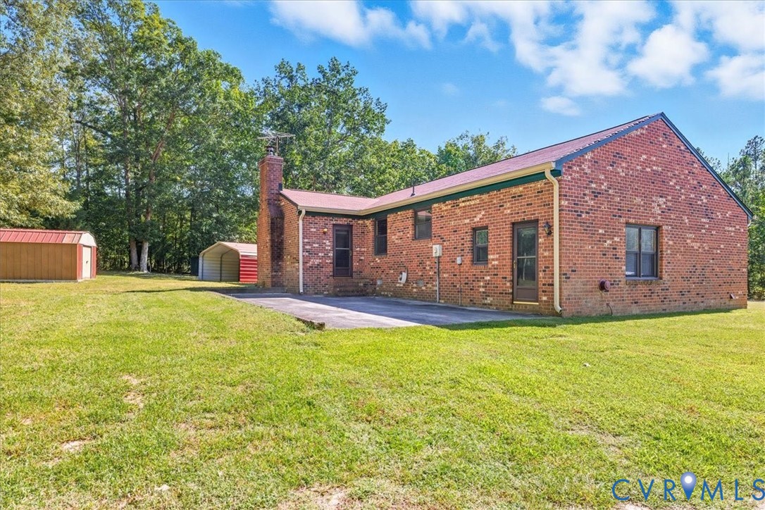 10200 Graves Road Petersburg, VA 23803 - Photo 33 of 45 Rear view of property with a yard, brick siding, a