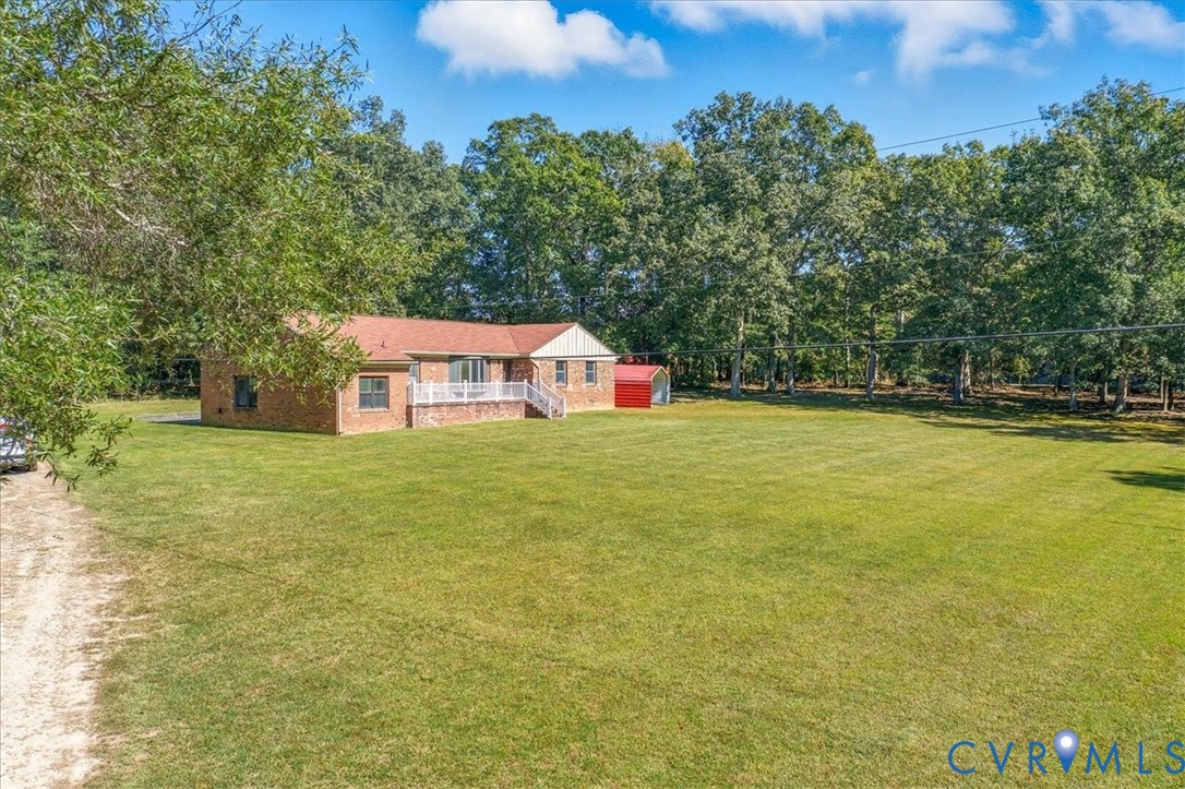 10200 Graves Road Petersburg, VA 23803 - Photo 43 of 45 View of green lawn with view of scattered trees an