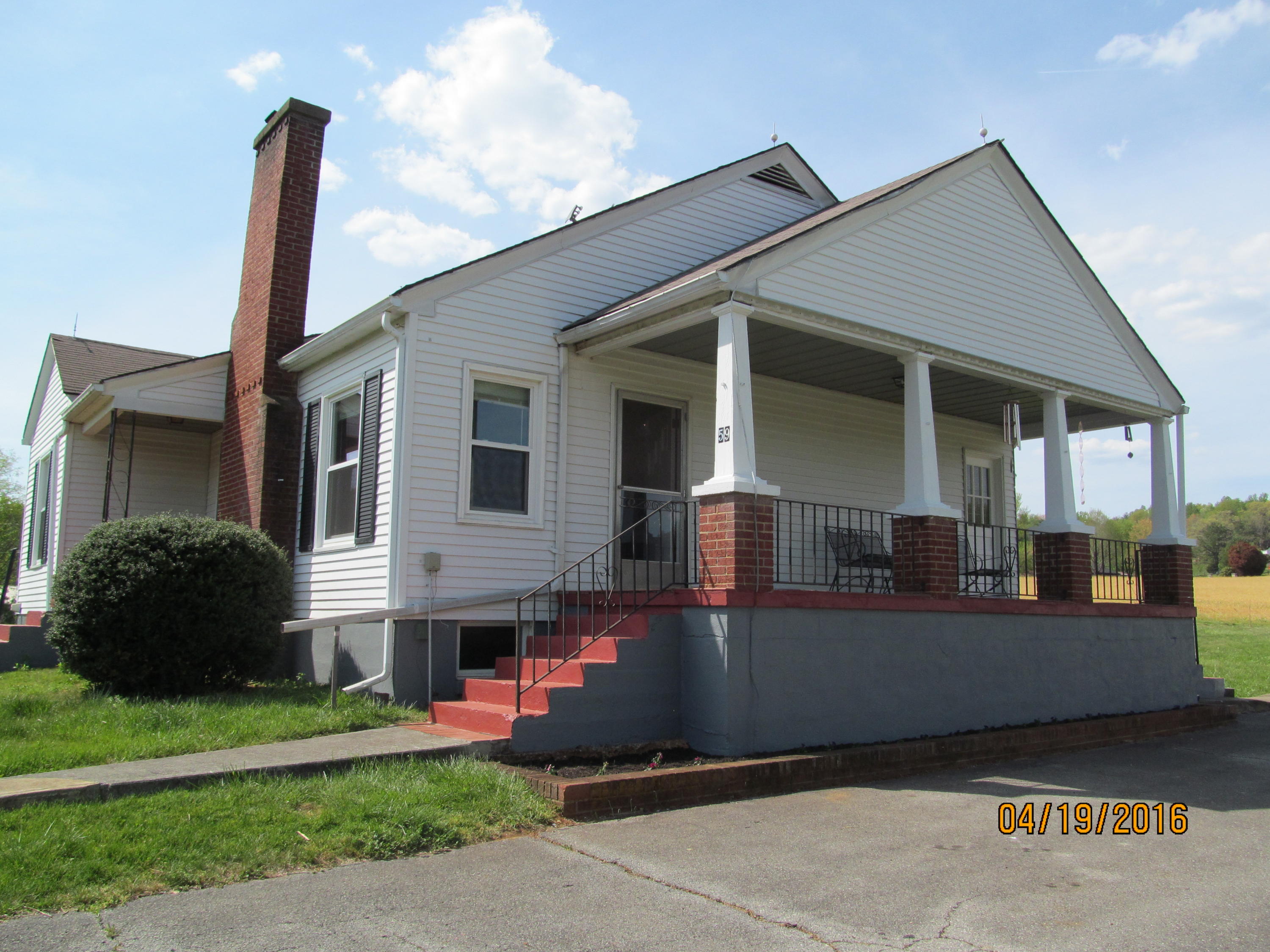 59 Whetstone Road Ferrum, VA 24088 - Photo 2 of 65 a front view of a house with a garden