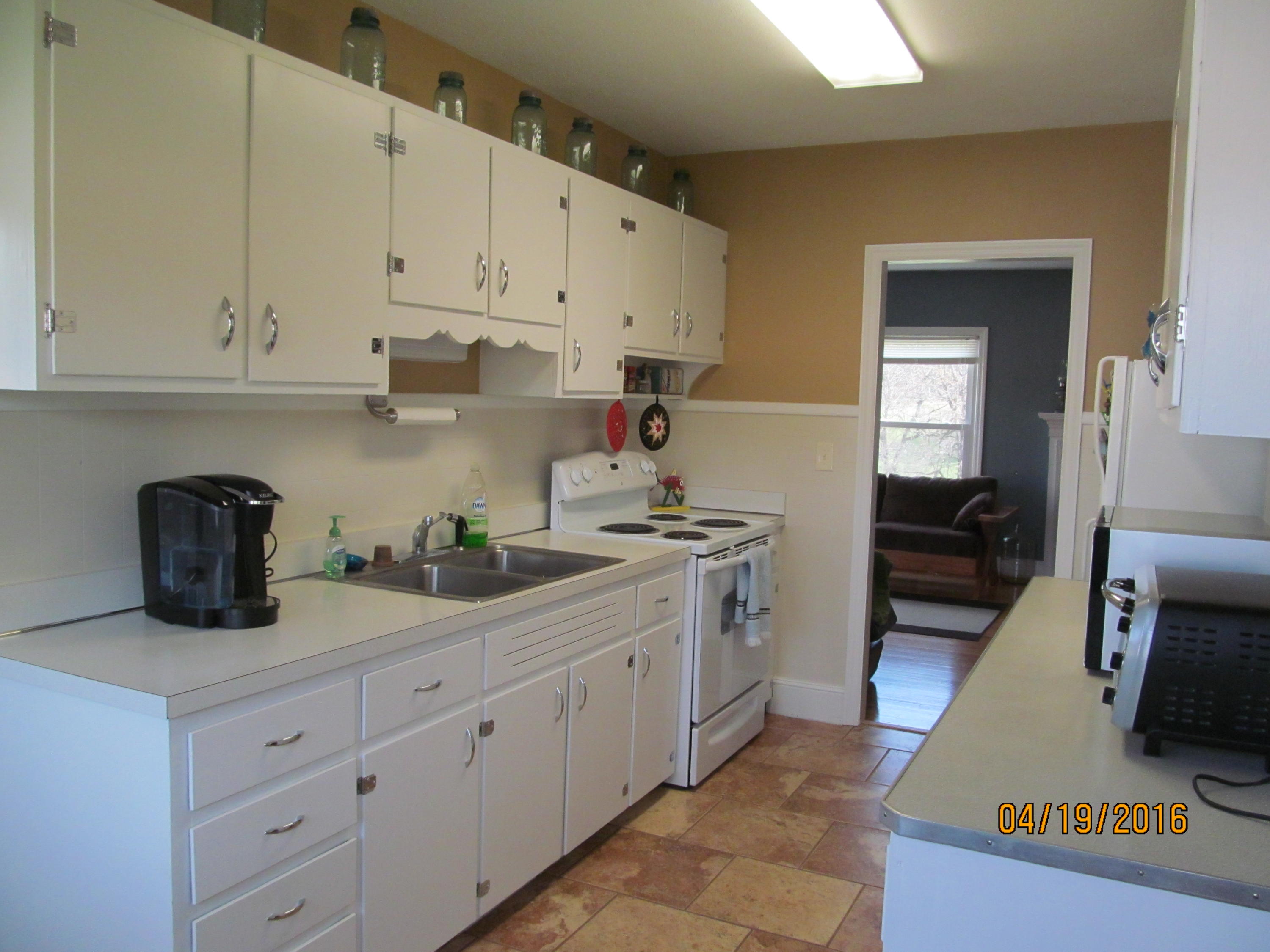 59 Whetstone Road Ferrum, VA 24088 - Photo 16 of 65 a kitchen with cabinets stainless steel appliances and wooden floor