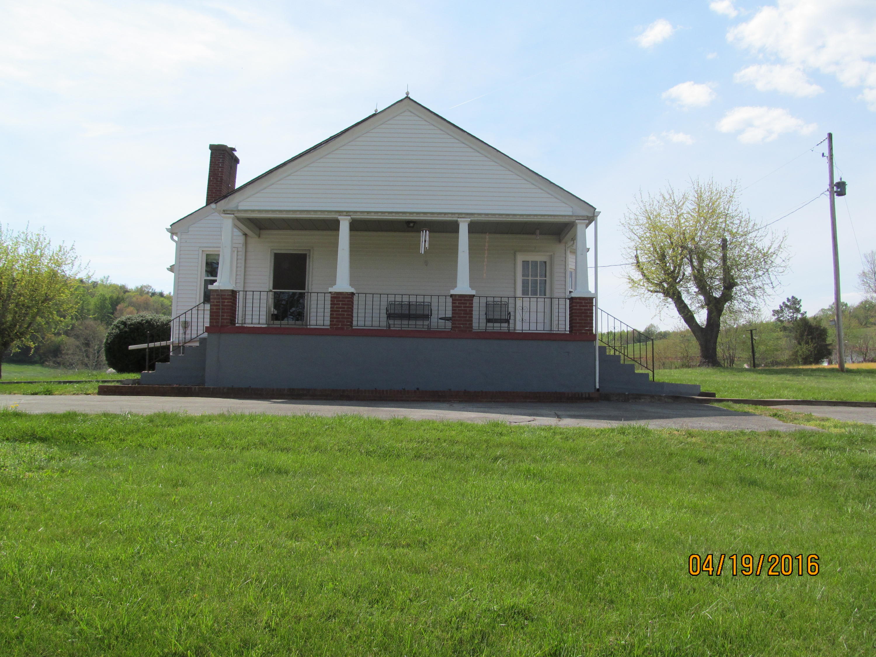59 Whetstone Road Ferrum, VA 24088 - Photo 3 of 65 a front view of a house with a garden and porch