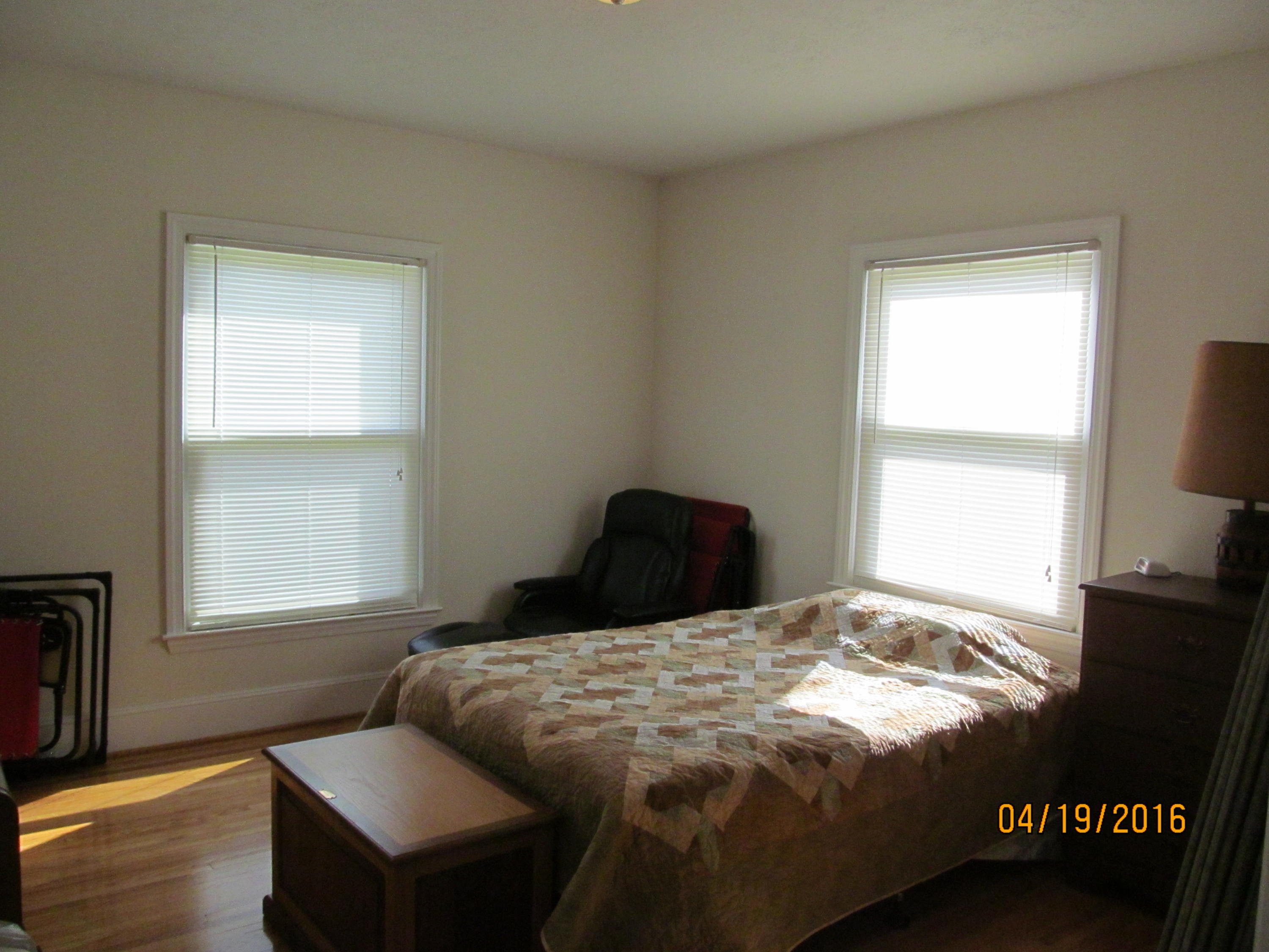 59 Whetstone Road Ferrum, VA 24088 - Photo 21 of 65 a bedroom with a bed and wooden floor