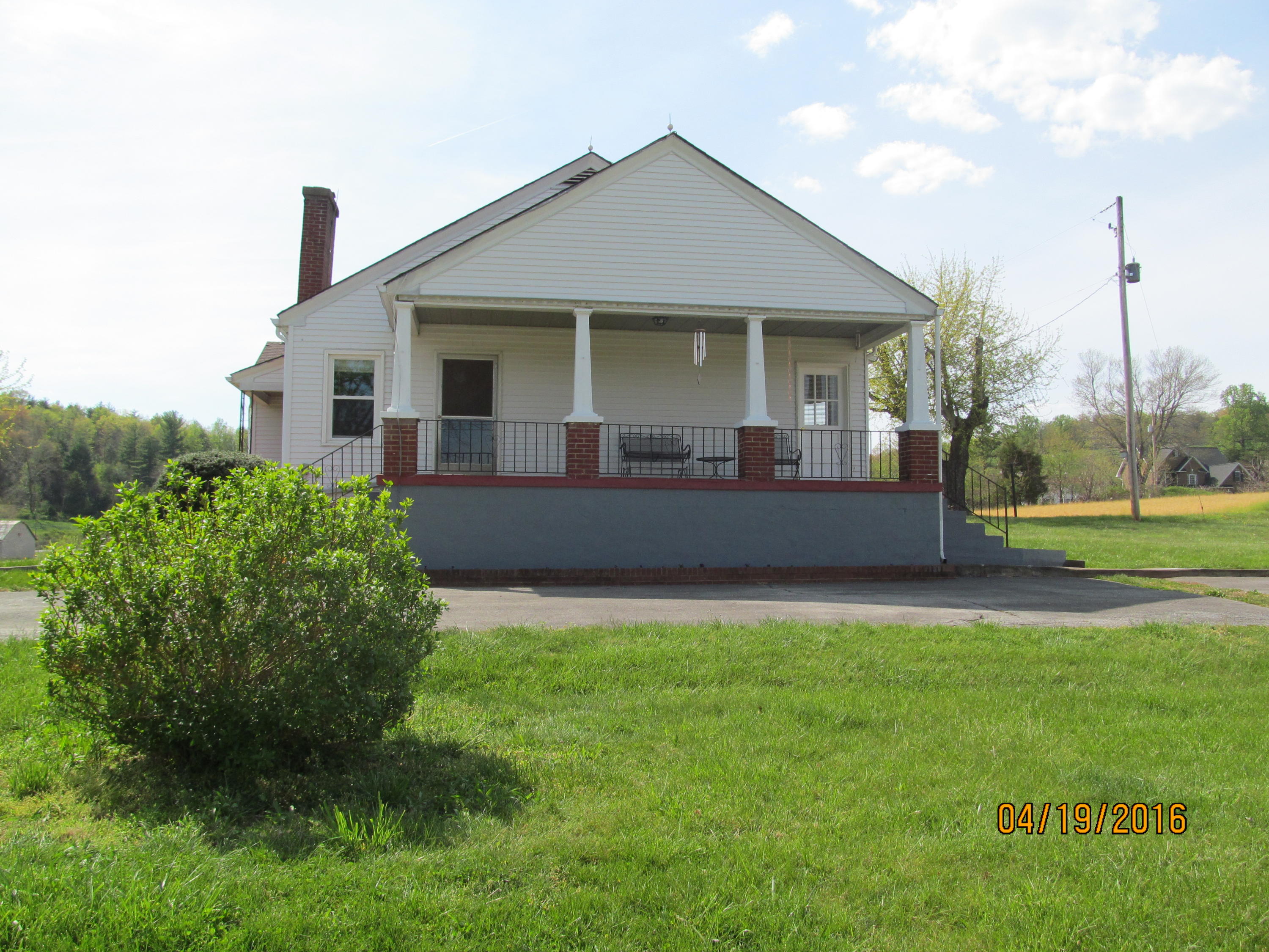 59 Whetstone Road Ferrum, VA 24088 - Photo 52 of 65 a front view of a house with a garden and yard