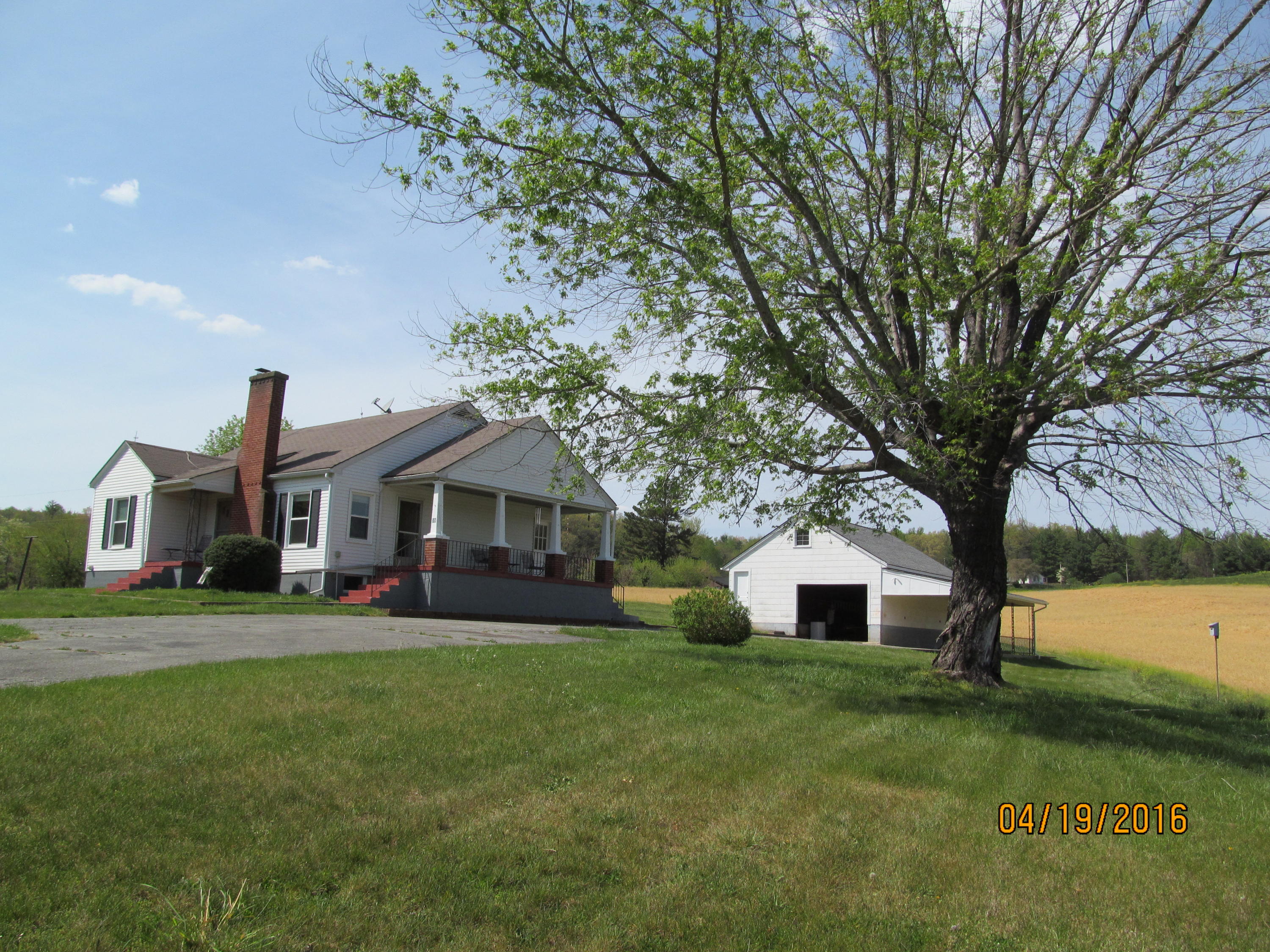 59 Whetstone Road Ferrum, VA 24088 - Photo 65 of 65 a front view of a house with a garden and trees