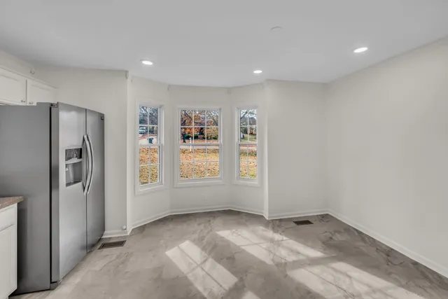 a view of empty room with front door