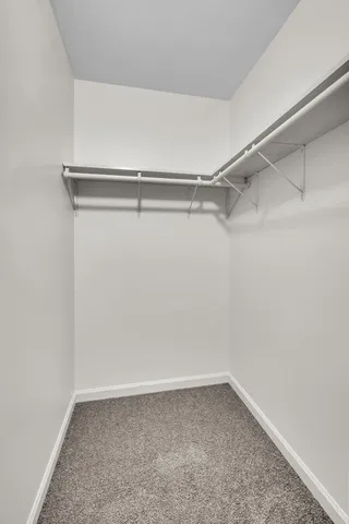 a view of an empty walk in closet