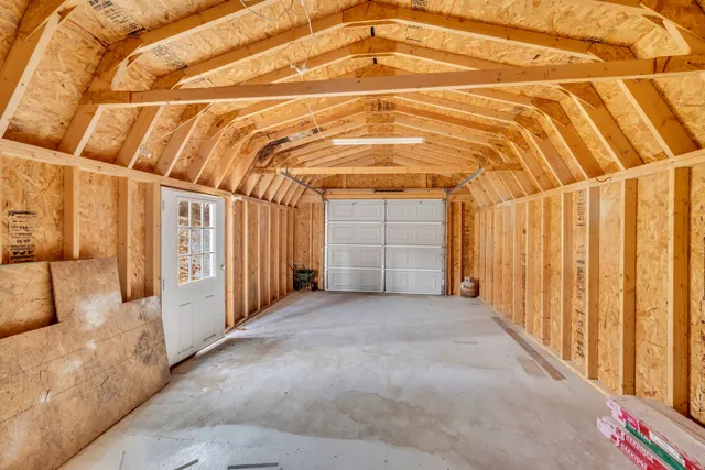 a view of a room with wooden walls