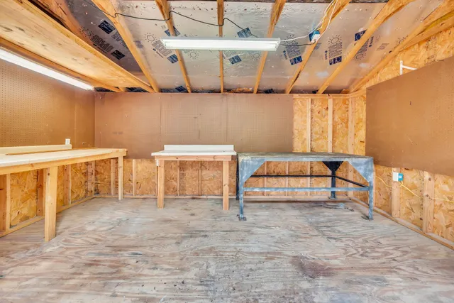 a spacious bedroom with a bed and a table