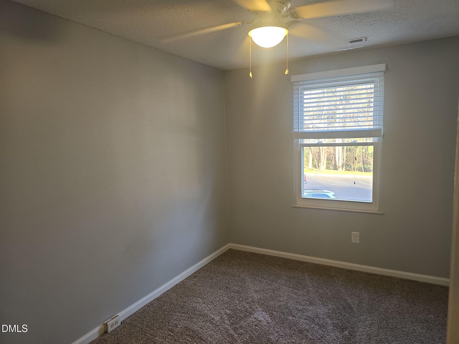 7825 Stephanie Lane Raleigh, NC 27615 - Photo 14 of 20 an empty room with a window