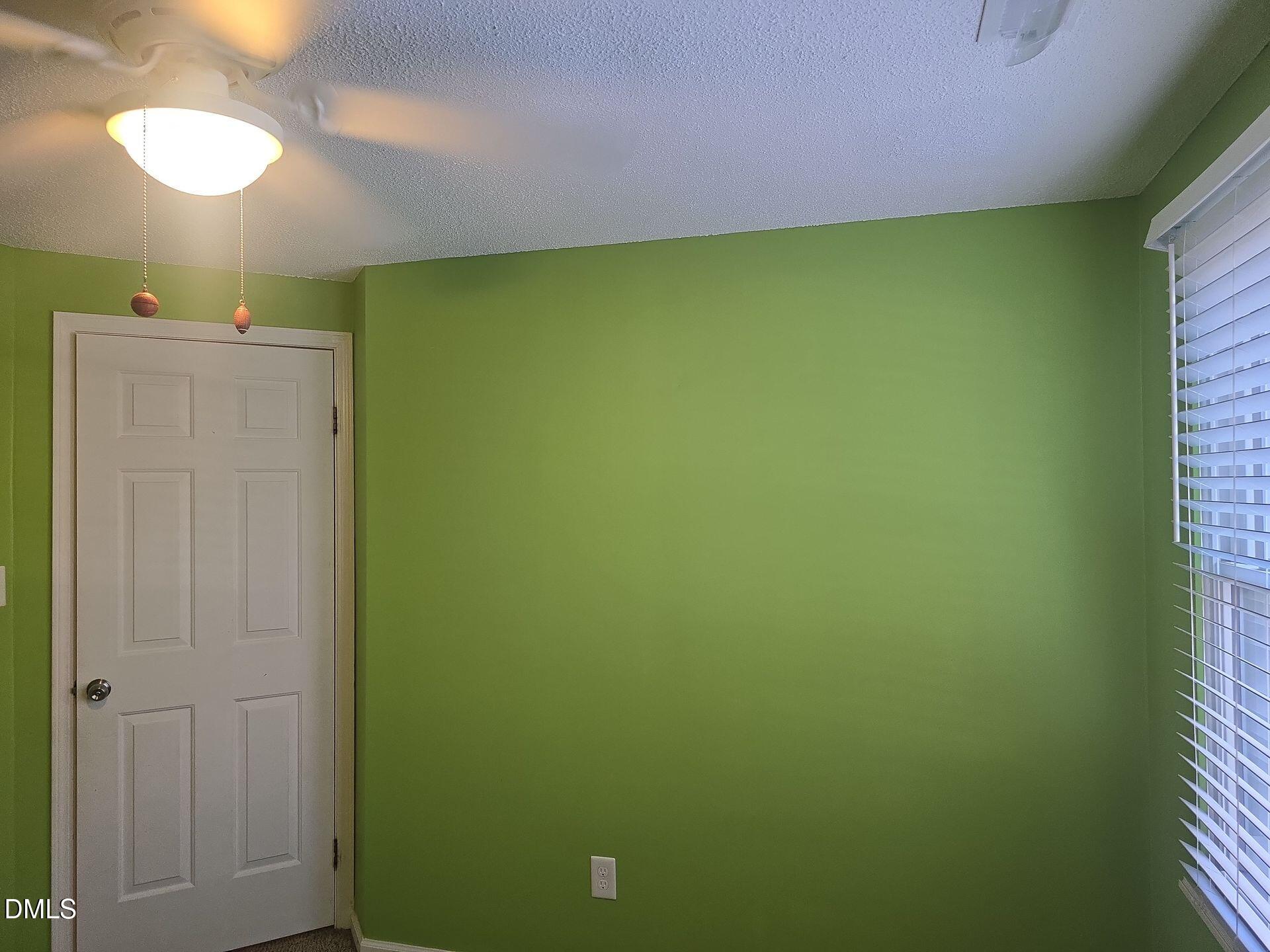 7825 Stephanie Lane Raleigh, NC 27615 - Photo 18 of 20 a bathroom with a shower curtain and a small yard