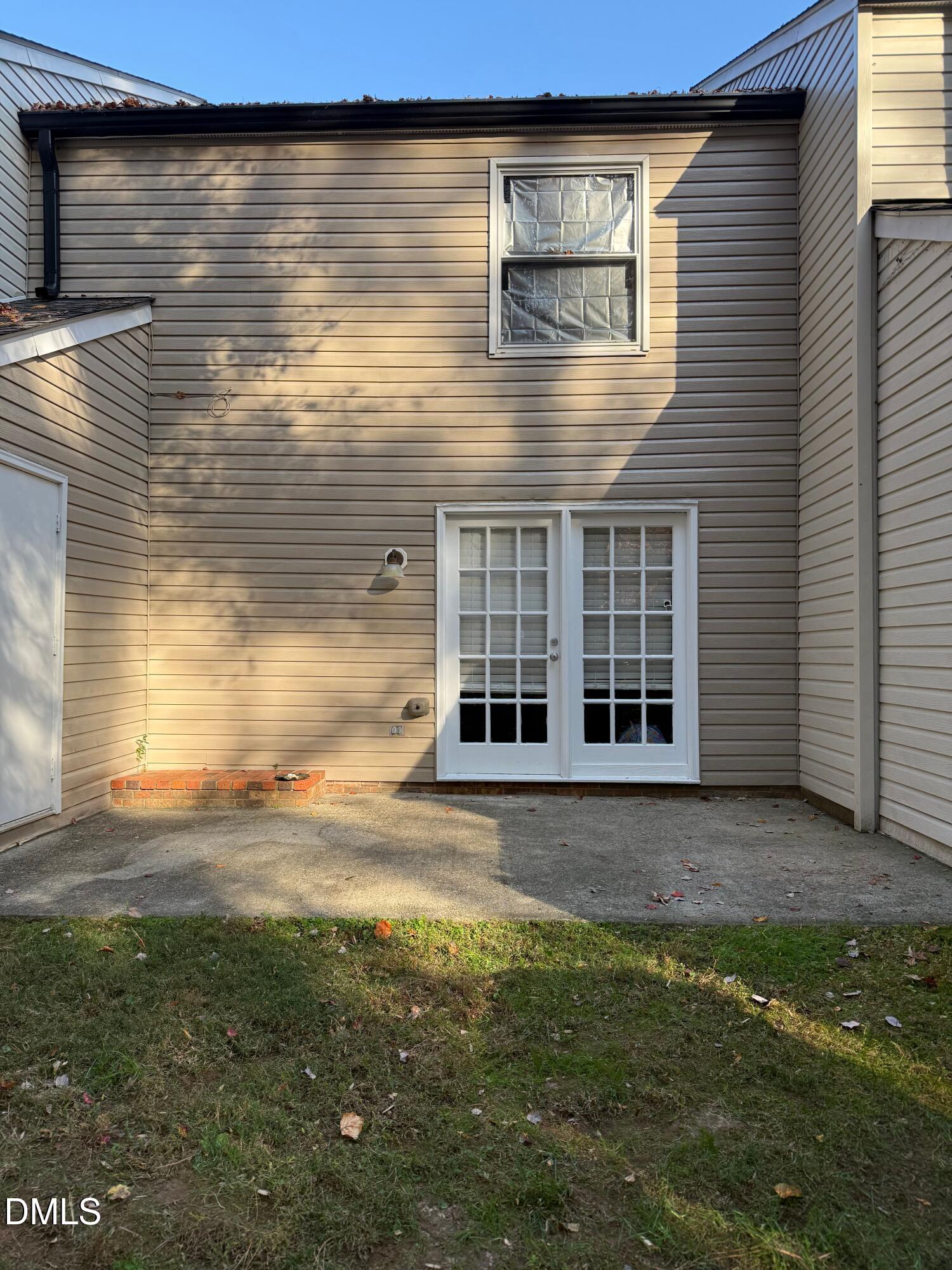 7825 Stephanie Lane Raleigh, NC 27615 - Photo 19 of 20 a view of a brick house with a yard