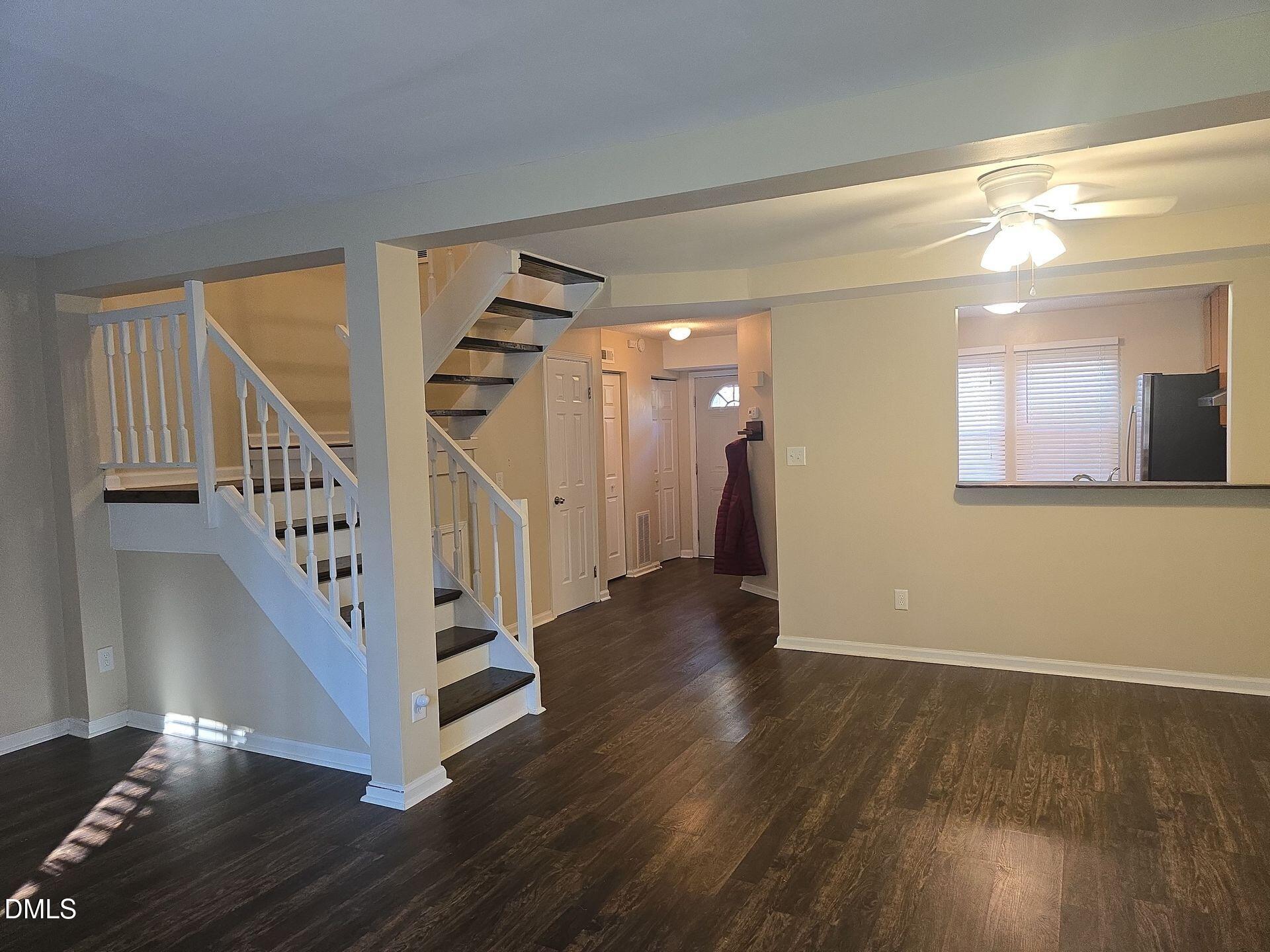 7825 Stephanie Lane Raleigh, NC 27615 - Photo 2 of 20 a view of entryway with wooden floor