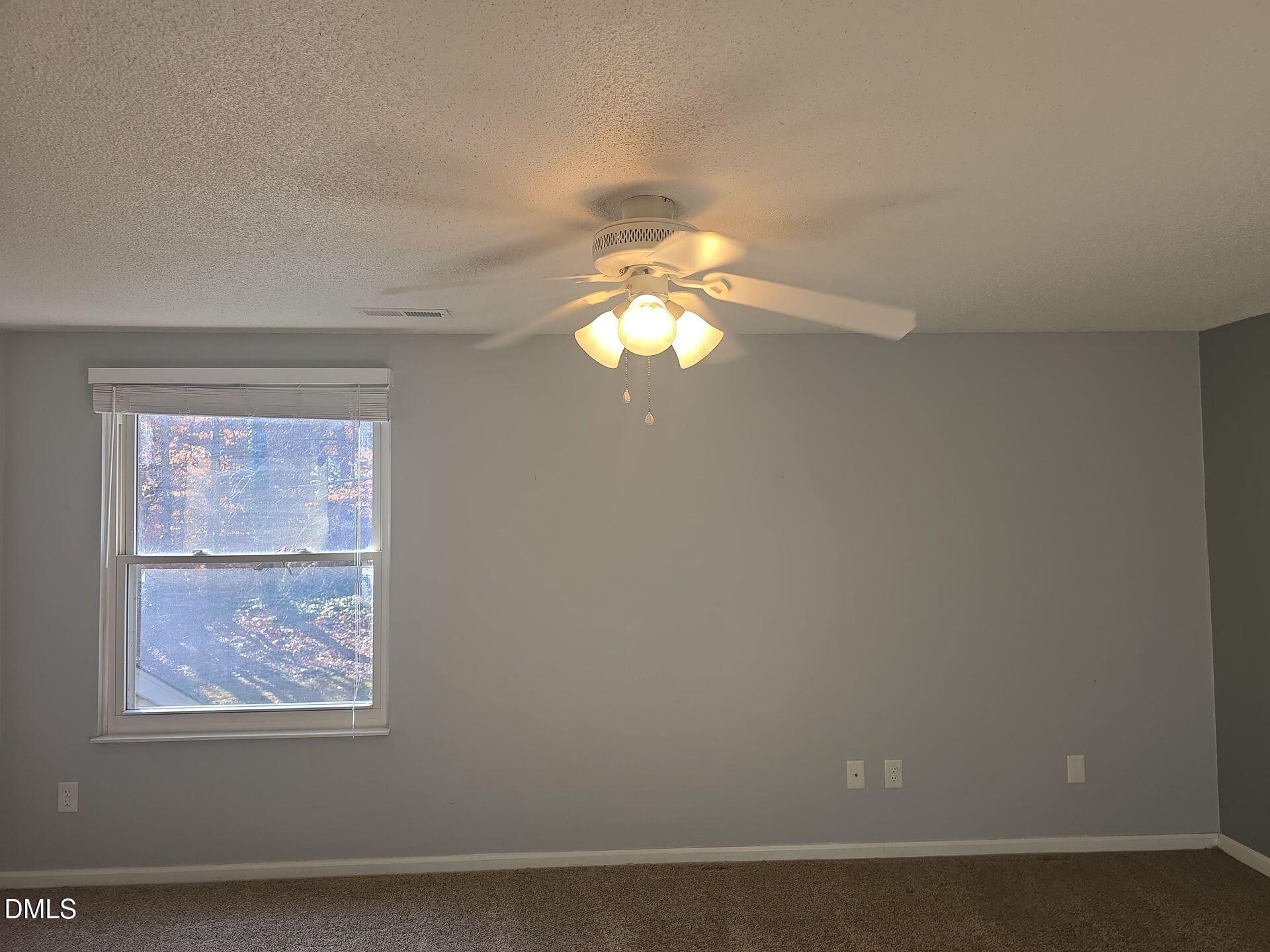 7825 Stephanie Lane Raleigh, NC 27615 - Photo 10 of 20 an empty room with a window