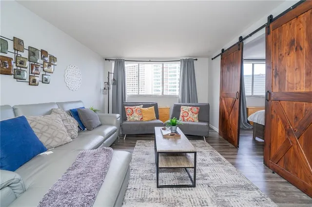 a living room with furniture and a rug
