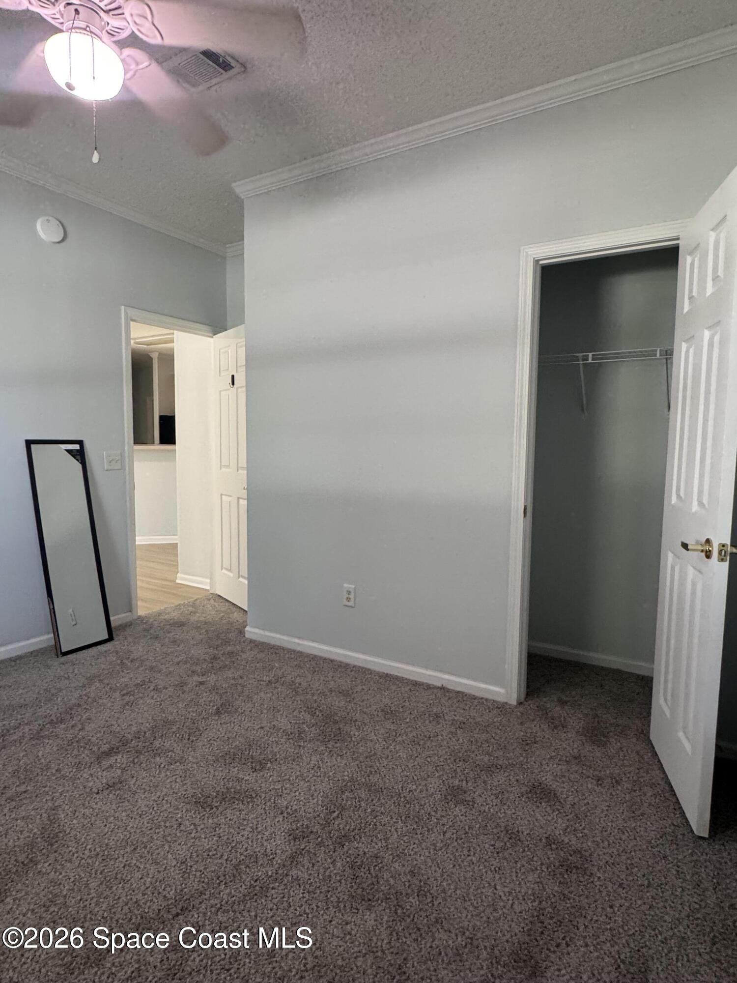 1130 Grapefruit Road Southeast Palm Bay, FL 32909 - Photo 12 of 14 a view of an empty room