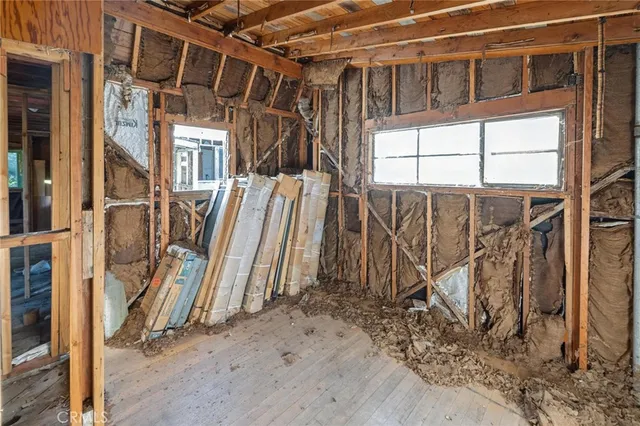 a view of a room with wooden walls