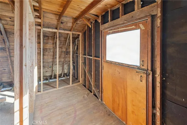 a view of a balcony with wooden floor